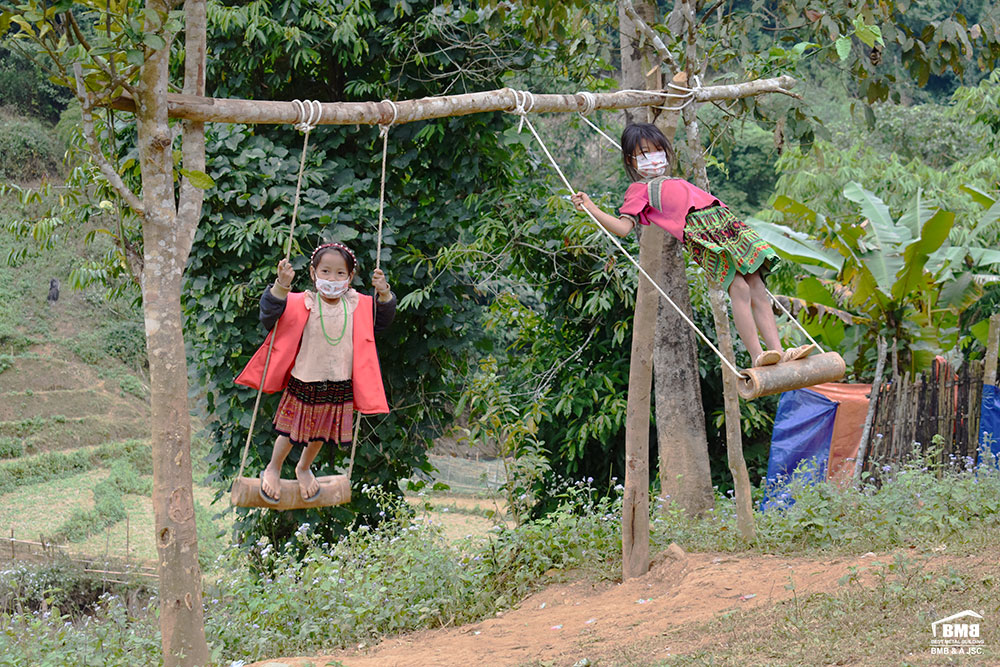 Children play happily despite the harsh cold of winter