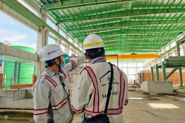 Construction engineer inspects construction details of 5,000m2 industrial factory