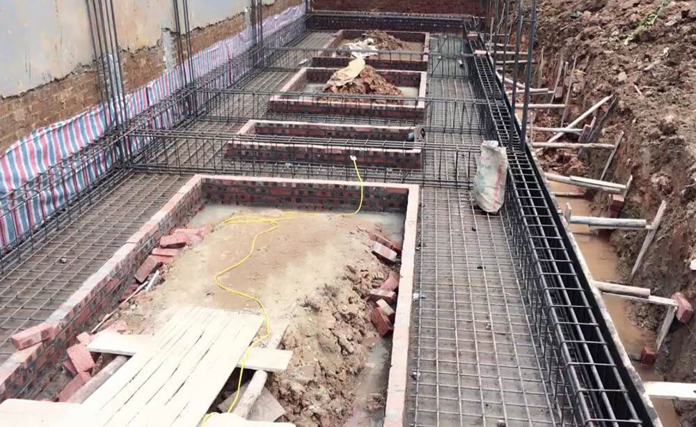 Continuous footing steel along the wall system