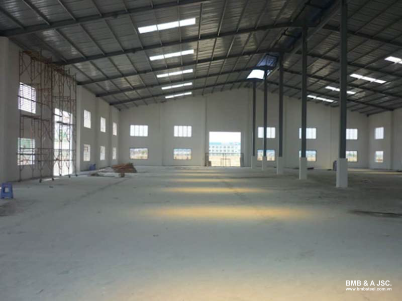 Robust small factory with concrete walls and metal roof