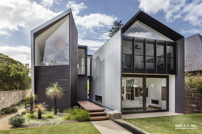 Two-story metal sheet pre-engineered building with standout sloped roof